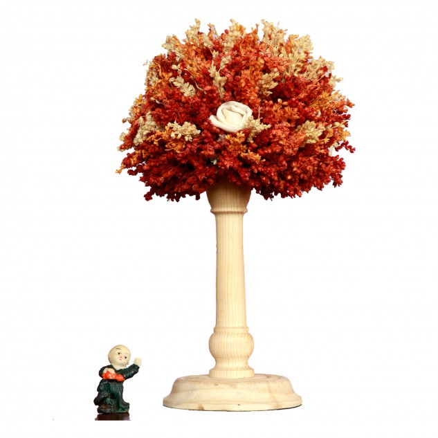 Handcrafted Orange Flower Arrangement on a Beautifully Carved Wooden Structure